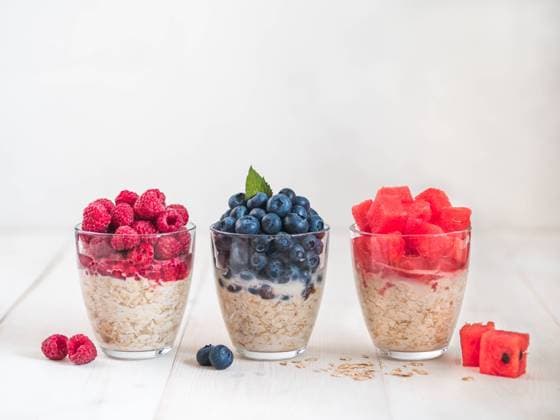 overnight oats with berries Healthy breakfast: overnight oats with fresh fruits and berries in glass. Overnight oatmeal porridge with watermelon, raspberry, blueberry,decorated mint. Overnight oats on white background,copy space Copyright: xZoonar.com OlgaxSergeevax 16389640