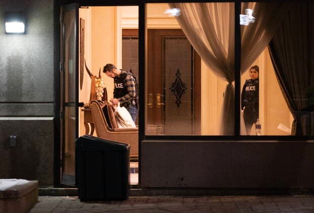 December 18, 2022, Vaughan, ON, CANADA: Police are seen in the lobby of a condo building following a shooting in Vaughan, Ont., Sunday, Dec. 18, 2022. Police say multiple people are dead, including the suspect, after a shooting in an apartment building. Vaughan CANADA - ZUMAc35_ 20221218_zaf_c35_130 Copyright: xArlynxMcadoreyx