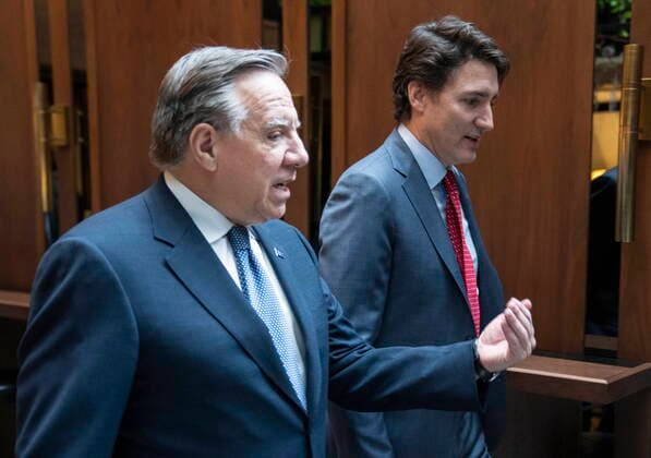 December 20, 2022, Montreal, PQ, Canada: Prime Minister Justin Trudeau and Quebec Premier Francois Legault chat while walking to a meeting in Montreal, on Tuesday, December 20, 2022. Montreal Canada  - ZUMAc35_ 20221220_zaf_c35_013 Copyright: xPaulxChiassonx