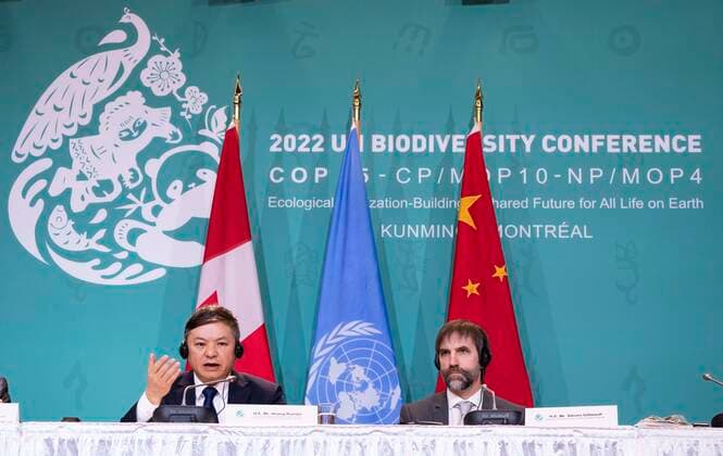 December 20, 2022, Montreal, PQ, Canada: Huang Runqiu, Minister of Ecology and Environment of China and president of the COP15, responds to a question as Canadian Environment Minister Steven Guilbeault looks on during the closing news conference at the COP15 UN conference on biodiversity in Montreal, on Tuesday, December 20, 2022. Montreal Canada  - ZUMAc35_ 20221220_zaf_c35_017 Copyright: xPaulxChiassonx