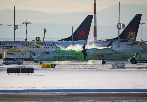 December 21, 2022, RICHMOND, BC, CANADA: An Air Canada aircraft is de-iced at Vancouver International Airport in Richmond, B.C., on Wednesday, Dec. 21, 2022. The airport is limiting international flights to carriers registered in Canada and the U.S. for two days as it attempts to clear a backlog of aircraft and passengers after a snowstorm caused massive disruptions this week. RICHMOND CANADA  - ZUMAc35_ 20221221_zaf_c35_031 Copyright: xDarrylxDyckx