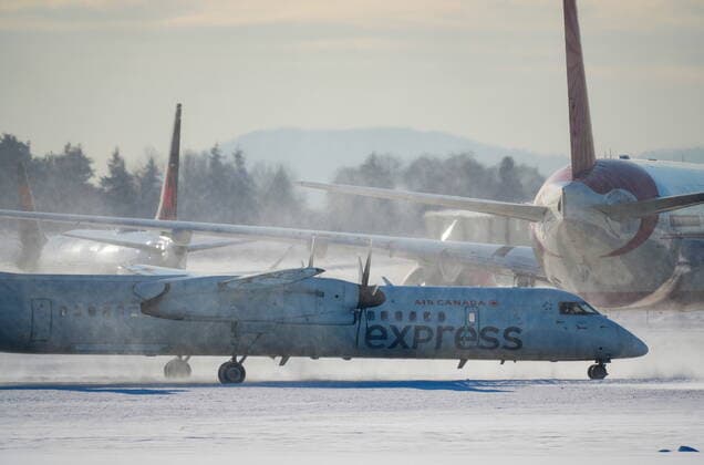 December 21, 2022, RICHMOND, BC, CANADA: An Air Canada aircraft taxis at Vancouver International Airport in Richmond, B.C., on Wednesday, Dec. 21, 2022. The airport is limiting international flights to carriers registered in Canada and the U.S. for two days as it attempts to clear a backlog of aircraft and passengers after a snowstorm caused massive disruptions this week. RICHMOND CANADA  - ZUMAc35_ 20221221_zaf_c35_032 Copyright: xDarrylxDyckx