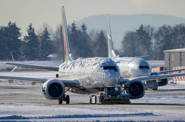 December 21, 2022, RICHMOND, BC, CANADA: An Air Canada aircraft covered with snow and ice is moved by a tug as a Westjet aircraft is seen being moved behind it at Vancouver International Airport in Richmond, B.C., on Wednesday, Dec. 21, 2022. The airport is limiting international flights to carriers registered in Canada and the U.S. for two days as it attempts to clear a backlog of aircraft and passengers after a snowstorm caused massive disruptions this week. RICHMOND CANADA  - ZUMAc35_ 20221221_zaf_c35_038 Copyright: xDarrylxDyckx