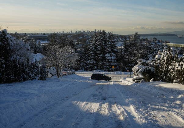 December 21, 2022, BURNABY, BC, CANADA: A motorist turns around after attempting to drive up a snow and ice covered hill in Vancouver, on Wednesday, December 21, 2022. A snowstorm dumped more than 30 centimetres of snow in Metro Vancouver this week. BURNABY CANADA  - ZUMAc35_ 20221221_zaf_c35_044 Copyright: xDarrylxDyckx