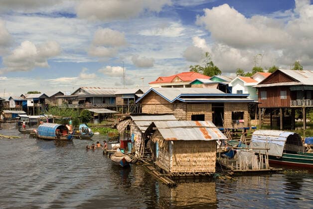 October 19, 2007, Cambodia: Village before reaching Tonle Sap Lake. Houseboats and boats in Sangker River, Cambodia...The drought in the largest lake in Cambodia puts the life of fish and forests in check...Tonlo Sap is the largest lake in Southeast Asia and the most productive inland fishing center in the world. In many places where native forest once grew, drab, barren, treeless farmland now converges as far as the eye can see. The fires, which are often set to clear land for agricultural uses, have further diminished the flooded forest...Deforestation and environmental degradation can inflict devastating economic damage on the nearly one million Cambodians who live around the lake and several million more who depend on it for fish, th - ZUMAr133 20071019_zap_r133_001 Copyright: xSergixReboredox