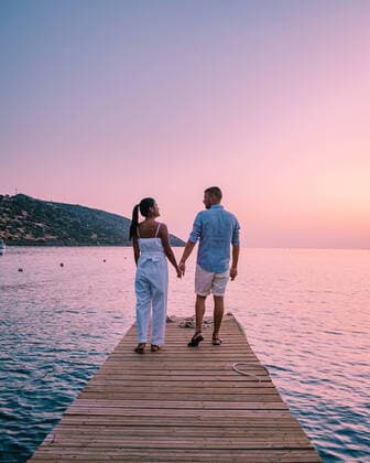 Creative Highlights Symbolbilder RECORD DATE NOT STATED young romantic couple in love is sitting and hugging on wooden pier at the beach in sunrise time with golden sky. Vacation and travel concept. Romantic young couple dating at seaside. Crete Greece, model released, , 34964196.jpg, crete, sunset, sunrise, Greece, pier, wooden, dock, beach, romantic, autumn, female, girlfriend, evening, honeymoon, women, jetty, mediterranean, happiness, valentine, vacation, scenic, destinations, enjoyment, vacations, outdoors, young, caucasian, love, sky, man, woman, sitting, sunlight, sea, two, lake, view, romance, together, silhouette, happy, travel, summer, sun, adult, water, holiday, mid age, couple, diversity