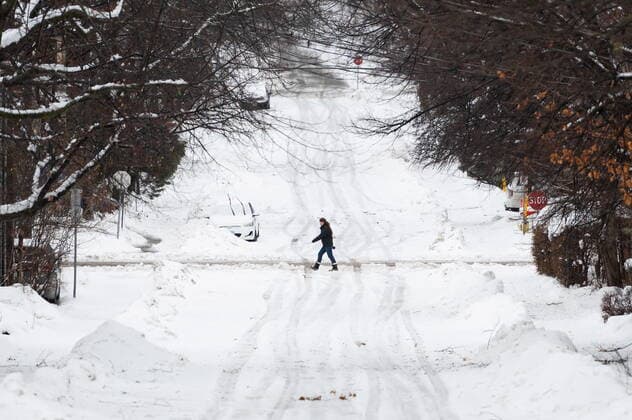 December 23, 2022, Ottawa, ON, Canada: A person makes their way through the Sandy Hill neighbourhood of Ottawa, on Friday, Dec. 23, 2022. Environment Canada has issued a winter storm warning for the region which is calling for flash freezing, icy and slippery surfaces, wind gusts and chills. Ottawa Canada  - ZUMAc35_ 20221223_zaf_c35_006 Copyright: xSpencerxColbyx