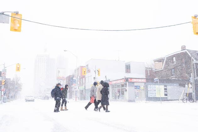 December 23, 2022, Toronto, ON, CANADA: Pedestrians cross Bloor Street during a snowstorm in Toronto on Friday, December, 23, 2022. A winter storm warning is in place for most of southern Ontario Toronto CANADA  - ZUMAc35_ 20221223_zaf_c35_051 Copyright: xArlynxMcadoreyx