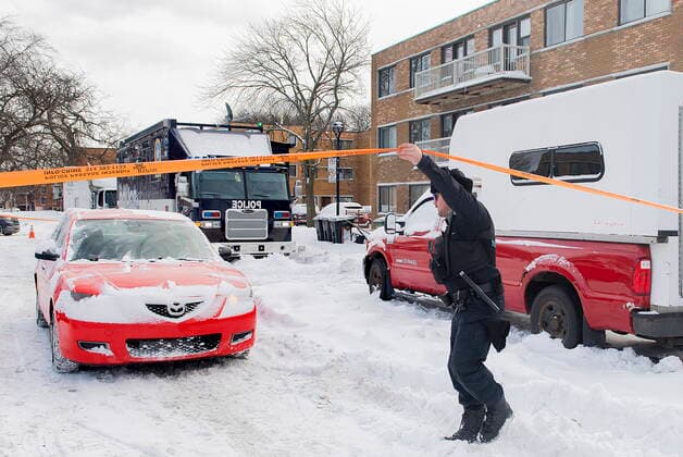December 27, 2022, Montreal, PQ, Canada: A police is shown at the scene outside an apartment building where two people were found dead in Montreal,Tuesday, December 27, 2022. Montreal police say a man and woman have died in the city s east end after what s believed to be a murder-suicide. Montreal Canada  - ZUMAc35_ 20221227_zaf_c35_004 Copyright: xGrahamxHughesx