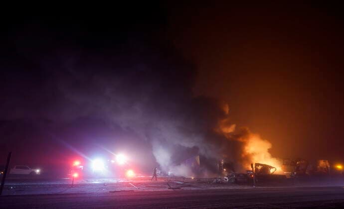 December 27, 2022, Crossfield, AB, CANADA: Emergency responders attend the scene of a multi-vehicle accident and fire near Crossfield, Alta., Tuesday, Dec. 27, 2022. The area was experiencing fog and freezing rain. Crossfield CANADA  - ZUMAc35_ 20221227_zaf_c35_097 Copyright: xJeffxMcintoshx