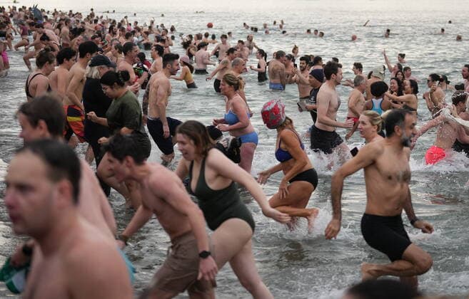 January 1, 2023, VANCOUVER, BC, CANADA: People take part in the Polar Bear Swim at English Bay, in Vancouver, B.C., Sunday, Jan. 1, 2023. This year s event was the first since 2020 after the past two years were cancelled due to the COVID-19 pandemic. According to the City of Vancouver the initial swim was in 1920 when approximately 10 swimmers participated. VANCOUVER CANADA  - ZUMAc35_ 20230101_zaf_c35_047 Copyright: xDarrylxDyckx