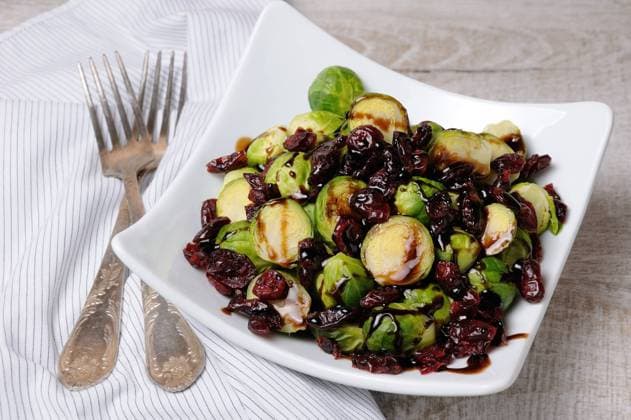 Salad from Brussels sprouts Salad from Brussels sprouts with dried cranberries under balsamic sauce Copyright: xZoonar.com MarynaxVoronovax 11631451