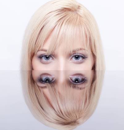 beautiful blonde and mirror portrait of young beautiful long-haired blonde woman sitting behind mirror table on gray Copyright: xZoonar.com sergxzastavkinx 2971146 ,model released, Symbolfoto ,property released