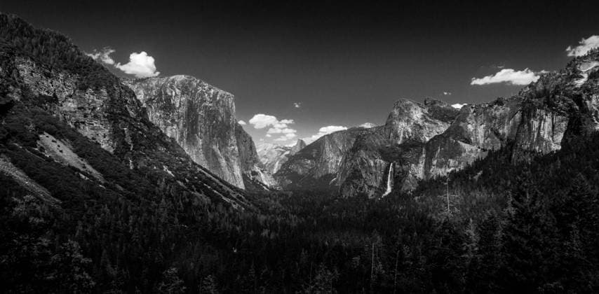RECORD DATE NOT STATED The iconic view of Yosemite Valley and the magnificent El Capitan from Tunnel View in California, USA , 25000712.jpg, beautiful, beauty, black and white, bw, california, cliff, clouds, cloudy, destination, dome, el capitan, evening, fall, forest, granite, high, idyllic, landmark, landscape, light, meadow, merced, mountain, national, natural, nature, outside, overlook, panorama, park, pine, rock, scenic, sky, storm, sunset, terrain, tourism, tree, tunnel, valley, valley view, view, viewpoint, wilderness, yosemite, ansel adams,