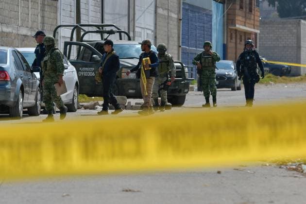 More than 20 bags with human remains found in clandestine grave in the State of Mexico January 13 in Tenango del Valle, Mexico : Forensic experts of the State of Mexico carry out the diligences where were found in a clandestine grave inside an industrial warehouse at least 26 packages with human remains; Military in company of the police of the State of Mexico guard the perimeter. on January 13 in Tenango del Valle, MÃ xico. (Photo by Arturo Hernandez Eyepix Group) Copyright: xArturoxHernandezx xEyepixxGroupx AH_130123_07