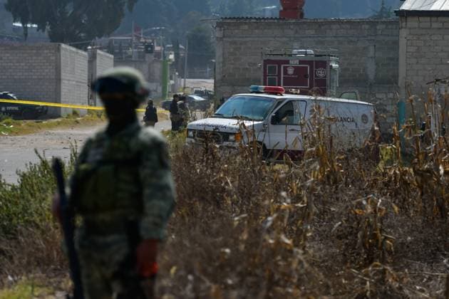 More than 20 bags with human remains found in clandestine grave in the State of Mexico January 13 in Tenango del Valle, Mexico : Forensic experts of the State of Mexico carry out the diligences where were found in a clandestine grave inside an industrial warehouse at least 26 packages with human remains; Military in company of the police of the State of Mexico guard the perimeter. on January 13 in Tenango del Valle, MÃ xico. (Photo by Arturo Hernandez Eyepix Group) Copyright: xArturoxHernandezx xEyepixxGroupx AH_130123_09