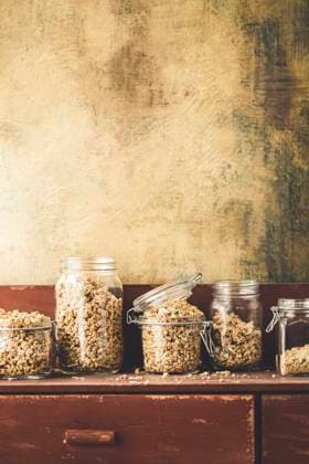 Homemade Granola in a jar on a rustic kitchen sideboard Homemade Granola in a jar on a rustic kitchen sideboard Copyright: xClaudiaxSilverstonex CS271022-29