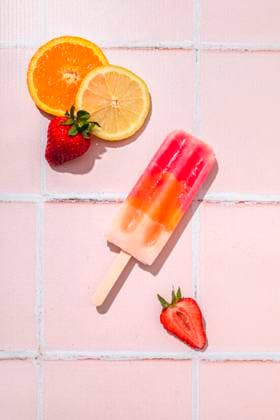 Fruit popsicle with ingredients over pink tile background Fruit popsicle with ingredients over pink tile background Copyright: xFlaviaxMorlachettix FLM201122-91