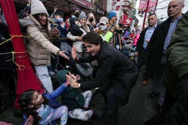 January 22, 2023, VANCOUVER, BC, CANADA: Prime Minister Justin Trudeau greets people in the crowd while marching in the Lunar New Year parade, in Vancouver, on Sunday, January 22, 2023. VANCOUVER CANADA  - ZUMAc35_ 20230122_zaf_c35_007 Copyright: xDarrylxDyckx
