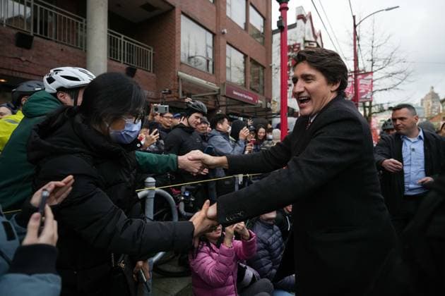 January 22, 2023, VANCOUVER, BC, CANADA: Prime Minister Justin Trudeau greets people in the crowd while marching in the Lunar New Year parade in Chinatown, in Vancouver, on Sunday, January 22, 2023. VANCOUVER CANADA  - ZUMAc35_ 20230122_zaf_c35_014 Copyright: xDarrylxDyckx