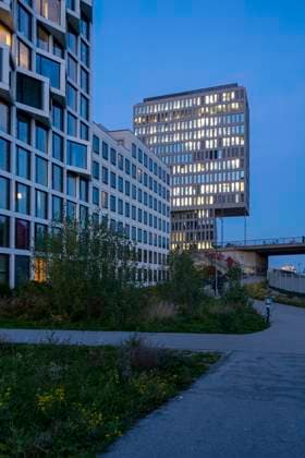 Germany, Bavaria, Munich, Modern office buildings at dusk, MAMF02350