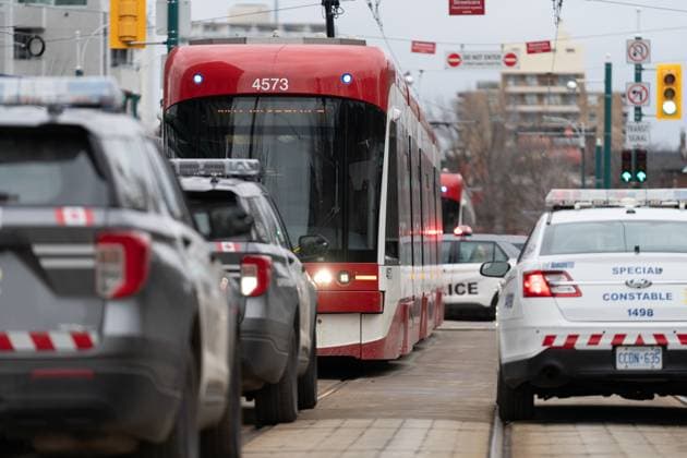 January 24, 2023, Toronto, ON, CANADA: Police cars surround a TTC streetcar on Spadina Ave., in Toronto on Tuesday, January 24, 2023. Police say a person was stabbed multiple times on a Toronto streetcar. They say the victim was sent to hospital and a suspect was arrested at the scene. Toronto CANADA  - ZUMAc35_ 20230124_zaf_c35_038 Copyright: xArlynxMcadoreyx