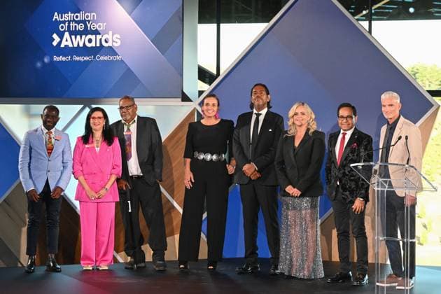 2023 AUSTRALIAN OF THE YEAR AWARDS, (L-R) Tasmania?s Australian of the year John Kamara, West Australia?s Australian of the year Prof. Samar Aoun, Northern Territory?s Australian of the year Samuel Bush-Blanasi, Australian Capital Territory?s Australian of the year Olympia Yarger, Queensland Australian of the year William Barton, South Australia?s Australian of the year Taryn Brumfitt, Victoria?s Australian of the year Dr Angraj Khillan and New South Wales?s Australian of the year Craig Foster pose for a photograph before the 2023 Australian of the Year Awards ceremony at the National Arboretum in Canberra, Wednesday, January 25, 2023. ( NO ARCHIVING, EDITORIAL USE ONLY, NO USE IN BOOKS WITHOUT CONSENT CANBERRA AC  Copyright: xMICKxTSIKASx 20230125001756401446
