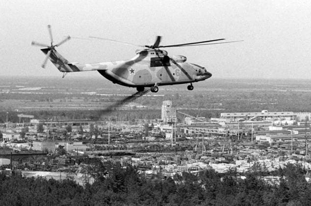 Kiev Region, Ukrainian SSR, USSR. The Mi-26 helicopter decontaminates the area from the air in the thirty-kilometer exclusion zone after the accident at the Chernobyl Nuclear Power Plant. On April 26, 1986, an explosion occurred in the reactor no. 4 of the nuclear power plant during equipment tests after the shutdown of the reactor for the next scheduled preventive maintenance. Valery Zufarov TASS  1470256