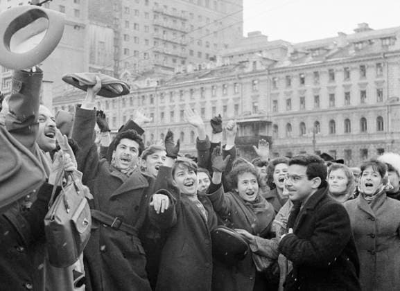 Moscow. The USSR. April 12, 1961. Muscovites listen to a radio message about a successful flight of Yuri Gagarin, the first human to journey into outer space on Revolution Square. Nikolay Kuleshov TASS  158363