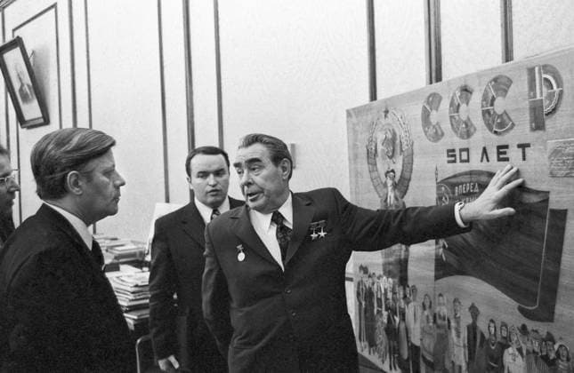 Moscow, USSR. General Secretary of the CPSU Central Committee Leonid Brezhnev (R) and Chancellor of the Federal Republic of Germany Helmut Schmidt (L) view the poster 50 years of the USSR during a meeting in the Kremlin. Vladimir Musaelyan TASS  510804