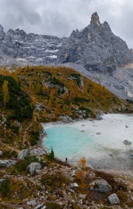 Creative Highlights World Scenic view of rocky formations with trees near calm lake in Dolomites Mountain ridge AlbertPalen_ID12533_380390_002 Copyright: xAlbertxPalenx Model Released