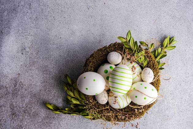 From above nest full of colored eggs as a easter holiday concept on concrete background AnnaBogush_ID12587_382566_008 Copyright: xAnnaxBogushx Model Released