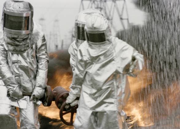 FIREMEN FIREPROOF OVERALLS OIL DERRICK 98206 27.08.1988 An emergency crew in fireproof overalls fight an oil derrick fire ??????? ??????? Sputnik Baku Azerbaijan  Copyright: x???????x???????x