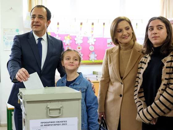 (230206) -- NICOSIA, Feb. 6, 2023 -- Former Cypriot Foreign Minister Nicos Christodoulides (L) , who runs as an independent, votes at a polling station in Pafos, Cyprus, Feb. 5, 2023. Former Cypriot Foreign Minister Nicos Christodoulides took the lead in Cyprus presidential election on Sunday, and will face off with Andreas Mavroyiannis, who came second, in a runoff on Feb. 12. (PIO Handout via Xinhua) CYPRUS-NICOSIA-PRESIDENTIAL ELECTION XinxHua 