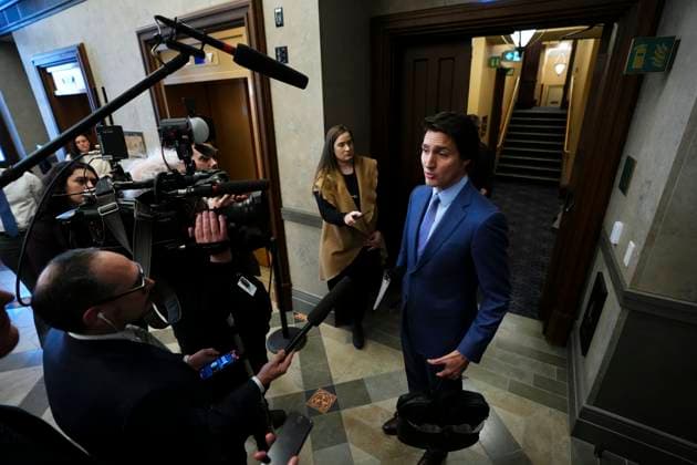 February 6, 2023, Ottawa, ON, Canada: Prime Minister Justin Trudeau talks to reporters in the foyer as he arrives for question period in the House of Commons on Parliament Hill in Ottawa on Monday, Feb. 6, 2023. Ottawa Canada  - ZUMAc35_ 20230206_zaf_c35_009 Copyright: xSeanxKilpatrickx