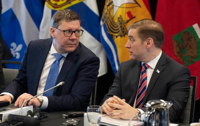 February 7, 2023, Ottawa, ON, Canada: Saskatchewan Premier Scott Moe (left) speaks with Newfoundland and Labrador Premier Andrew Furey as they wait to start a meeting of CanadaöÄÃ s premiers, Tuesday, February 7, 2023 in Ottawa. Ottawa Canada  - ZUMAc35_ 20230207_zaf_c35_017 Copyright: xAdrianxWyldx