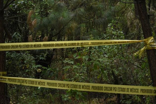 February 10, 2023 Lerma , Mexico : Aspects of the area where forensic experts from the State of Mexico conducted the proceedings where at least 9 clandestine graves were found in the forest on the border of the municipalities of Lerma and Ocoyoacac, unofficially have found a total of 68 packages with human remains, the area where these graves are still cordoned off to prevent the passage, where it is expected to continue working to locate more human remains. on February 10 , 2023 in Lerma, Mo xico. Lerma Mexico - ZUMAe321 20230211_zia_e321_004 Copyright: xArturoxHernandezx