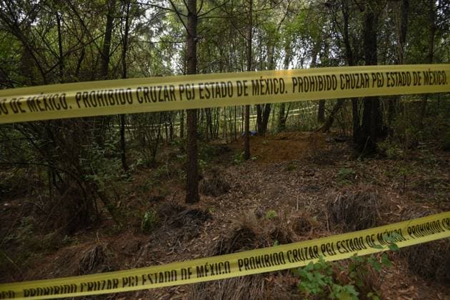 February 10, 2023 Lerma , Mexico : Aspects of the area where forensic experts from the State of Mexico conducted the proceedings where at least 9 clandestine graves were found in the forest on the border of the municipalities of Lerma and Ocoyoacac, unofficially have found a total of 68 packages with human remains, the area where these graves are still cordoned off to prevent the passage, where it is expected to continue working to locate more human remains. on February 10 , 2023 in Lerma, Mo xico. Lerma Mexico - ZUMAe321 20230211_zia_e321_007 Copyright: xArturoxHernandezx