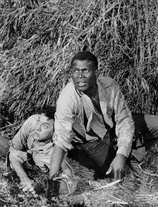Tony Curtis, Sidney Poitier, on-set of the Film, The Defiant Ones , United Artists, 1958  Copyright: xABxArchivesx jtv016680