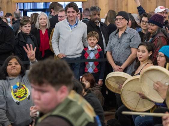 February 12, 2023, Whitehorse, YT, CANADA: Prime Minister Justin Trudeau and his son, Hadrien, watch a traditional First Nations game called stick gambling at the Council of Yukon First Nations Together Today For Our Children Tomorrow 50th Anniversary celebrations at the Kwanlin DoÂ¼n Cultural Centre in Whitehorse, Yukon on Sunday February 12, 2023. Whitehorse CANADA  - ZUMAc35_ 20230212_zaf_c35_015 Copyright: xMikexThomasx