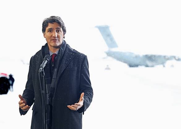 February 13, 2023, Whitehorse, YUKON, CANADA: Prime Minister Justin Trudeau speaks on the edge of the tarmac at Erik Nielsen International Airport with a RCAF Boeing C-17 Globemaster in the background during a press conference in Whitehorse, Yukon, on February 13, 2023. Whitehorse CANADA  - ZUMAc35_ 20230213_zaf_c35_072 Copyright: xMikexThomasx