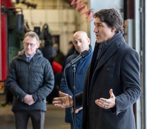 February 13, 2023, Whitehorse, YUKON, CANADA: Prime Minister Justin Trudeau speaks at Erik Nielsen International Airport during a press conference while Yukon MP Brendan Hanley, left, and Yukon Premier Ranj Pillai look on in Whitehorse, Yukon, on February 13, 2023. Whitehorse CANADA  - ZUMAc35_ 20230213_zaf_c35_078 Copyright: xMikexThomasx