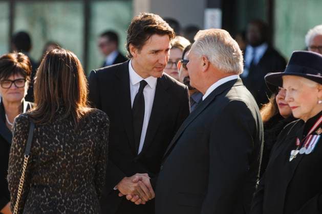 February 14, 2023, MISSISSAUGA, ON, CANADA: Prime Minister Justin Trudeau shakes hands with Doug Ford, Premier of Ontario, at the Paramount Fine Foods Centre during the state funeral for former Mississauga mayor Hazel McCallion in Mississauga, Ontario, Tuesday, Feb.14, 2023. MISSISSAUGA CANADA - ZUMAc35_ 20230214_zaf_c35_086 Copyright: xColexBurstonx