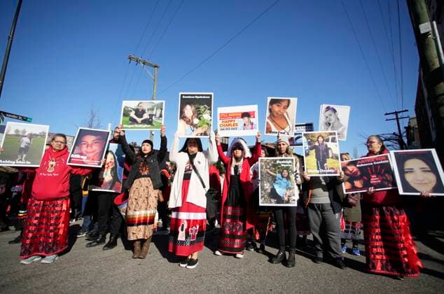 (230214) -- VANCOUVER, Feb. 14, 2023 -- Indigenous women holding photos of victims participate in the Women s Memorial March in Vancouver, British Columbia, Canada, on Feb. 14, 2023. Thousands of people participated in the march to commemorate the missing and murdered indigenous women and girls. (Photo by Xinhua) CANADA-VANCOUVER-WOMEN S MEMORIAL MARCH LiangxSen 