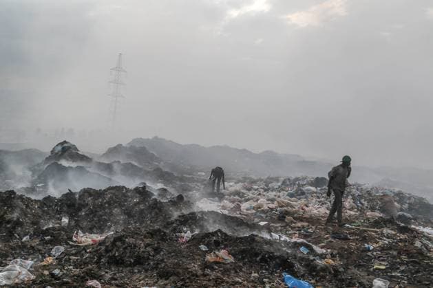 February 16, 2023, Nakuru, Kenya: Waste pickers collect things amidst heavy smoke from burning garbage, mostly plastic, textiles among other waste at Gioto Dumping site. An investigation by Kenyan nonprofit environmental group Clean-Up Kenya and Wild light for the Changing Markets Foundation found that European countries are dumping 37 million items of unusable plastic clothing in Kenya every year. The investigation found that more than one in three pieces of used clothing shipped to Kenya are of substandard quality and immediately the bails are opened, they become waste. Nakuru Kenya - ZUMAs197 20230216_zab_s197_043 Copyright: xJamesxWakibiax