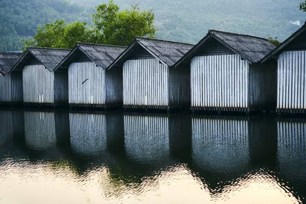 Row of houses on the river Row of houses on the river with reflections in the water Copyright: xZoonar.com ViktorxGladkovx 14011935