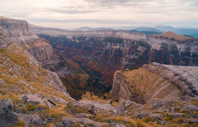 Picturesque view of rocky mountains with uneven slopes under cloudy sky with sunshine in Ordesa y Monte Perdido JavierMartinez_ID12785_387885_045 Copyright: xJavierxMartinezx Model Released