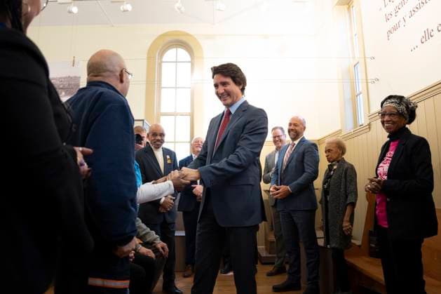 February 23, 2023, Halifax, NS, Canada: Prime Minister Justin Trudeau, centre, is greeted by community members at the Africville museum in Halifax on Thursday, February 23, 2023. Halifax Canada  - ZUMAc35_ 20230223_zaf_c35_091 Copyright: xDarrenxCalabresex