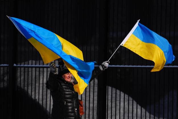 February 24, 2023, Ottawa, Ontario, Canada: People demonstrate against the war in the Ukraine in front of the Russian embassy in Ottawa on Friday, Feb. 24, 2023. Ottawa Canada  - ZUMAc35_ 20230224_zaf_c35_020 Copyright: xSeanxKilpatrickx