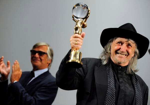 FILE - In the file photo, Slovakian director Juraj Jakubisko shows a Crystal Globe for his long-term contribution to world cinematography he received prior the world premiere of his historical thriller Bathory during the 43rd International Film Festival in Karlovy Vary, Czech Republic, on July 5, 2008. One of the leading film-makers of the Czechoslovak New Film Wave of the 1960s, died in Prague, where he lived, on Friday, Feb. 24, 2023. He was 84. (CTKxPhoto RenexVolfik) CTKPhotoP200807050280601  CTKPhotoP200807050280601